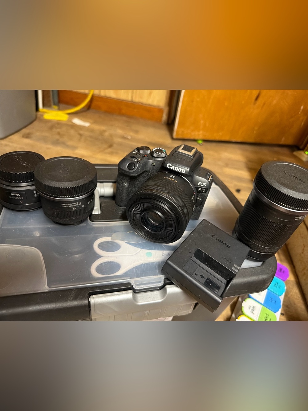Canon EOS R10 Compact Mirrorless Camera with Multiple Black Lenses and Charger